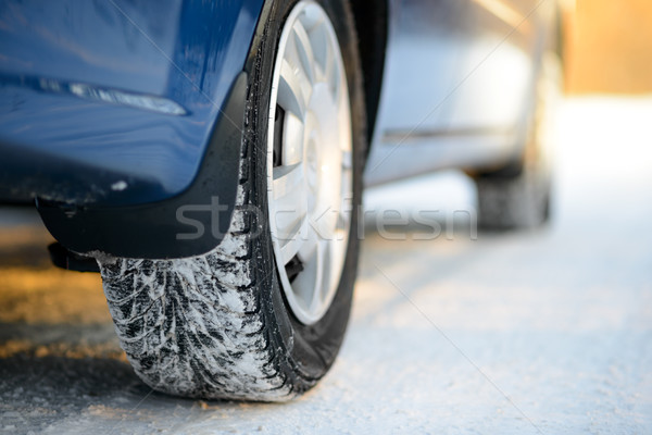 Close-up Image of Winter Car Tire on the Snowy Road. Drive Safe. Stock photo © maxpro