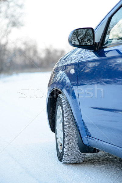 Blue Car with Winter Tires on the Snowy Road. Drive Safe. Stock photo © maxpro