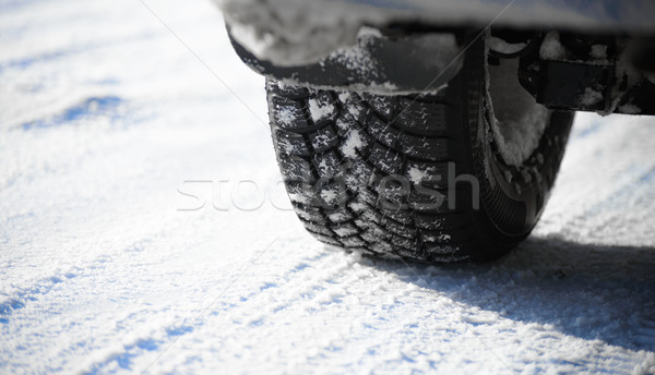 Close-up Image of Winter Car Tire on Snowy Road. Drive Safe Concept Stock photo © maxpro