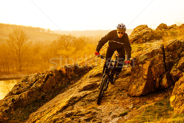 Enduro Cyclist Riding the Mountain Bike Down Beautiful Rocky Trail. Extreme Sport Concept. Space for Stock photo © maxpro