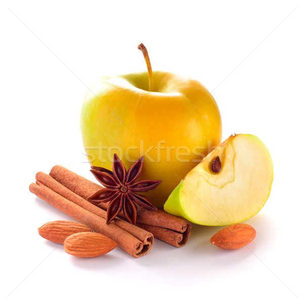 Yellow Apple with Apple Slice, Almond Nuts, Cinnamon Sticks and  Stock photo © maxpro