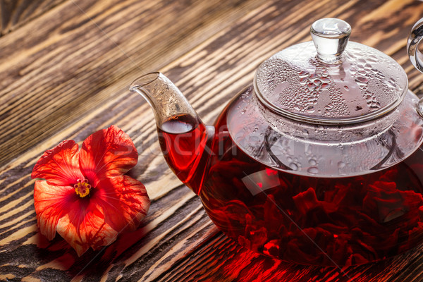 Hibiszkusz tea teáskanna fa asztal világszerte népszerű Stock fotó © maxsol7