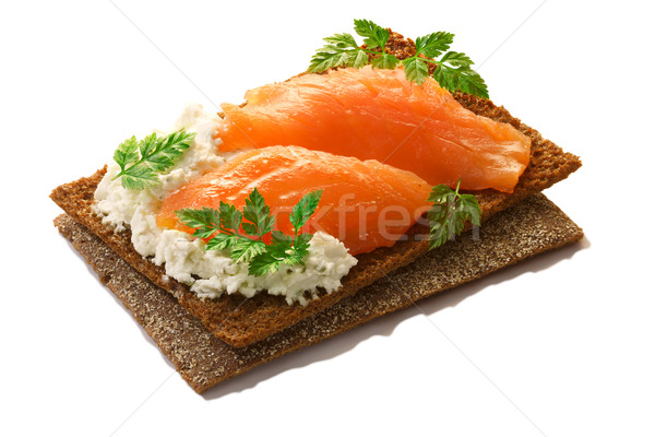Stock photo: Bread crisp with salmon, soft cheese and chervil