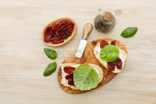 Sandwiches with mascarpone, dried tomatoes, basil Stock photo © maxsol7