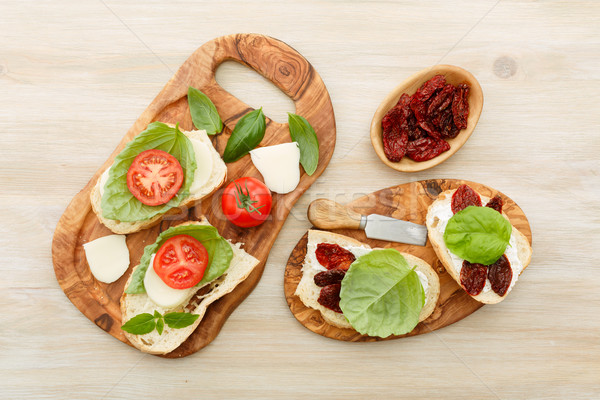Sandwiches with mascarpone, dried tomatoes, basil Stock photo © maxsol7