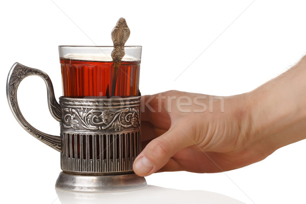 Imagine de stoc: Mână · sovietic · sticlă · ceai · lingurita