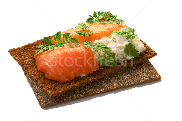 Stock photo: Bread crisp with salmon, soft cheese and chervil