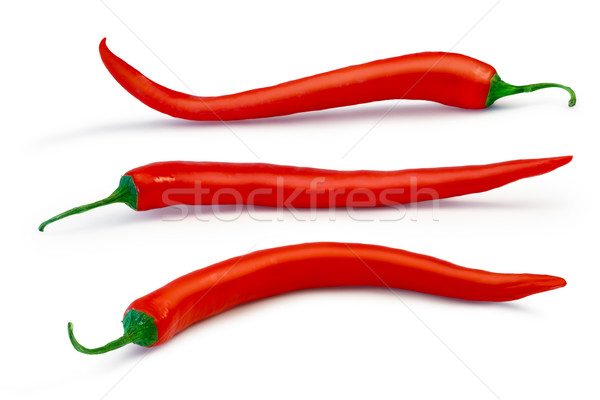 Long curvy chili peppers Stock photo © maxsol7