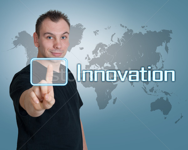 Innowacja młody człowiek naciśnij cyfrowe przycisk interfejs Zdjęcia stock © Mazirama