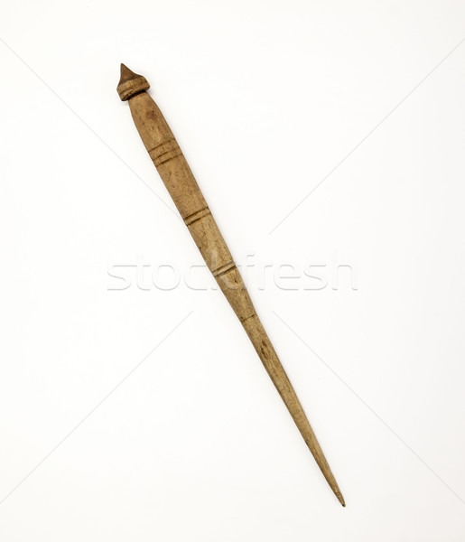 Old wooden spindle for the manufacture of woolen threads on a white background. Stock photo © mcherevan
