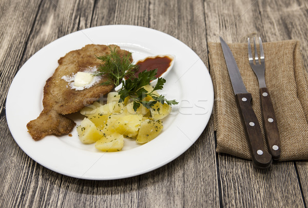 Petite Wiener schnitzel with boiled potatoes and ketchup. Served on a white porcelain plate with for Stock photo © mcherevan