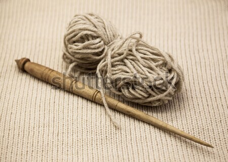 Two old wooden spindle with a ball of wool thread for the manufacture of woolen threads on a wooden  Stock photo © mcherevan