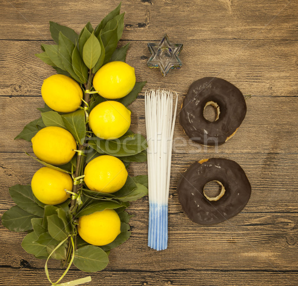  Branch lemons  donuts candles  crown of thorns and goat horn. Symbols of the great holiday of Hanuk Stock photo © mcherevan