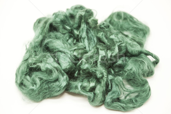 Aquamarine green piece of Australian sheep wool Merino breed close-up on a white background Stock photo © mcherevan