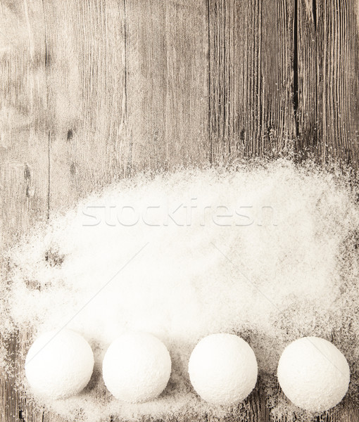 Christmas card with snowballs and snow on a wooden background. Stock photo © mcherevan