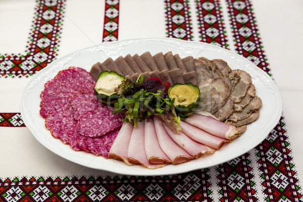 Banquet menu. A delicious assortment of salami, smoked meat, roast beef, beef tongue, horseradish an Stock photo © mcherevan