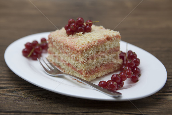 Fresh delicious diet cake with berry red currant at Dukan Diet on a porcelain plate with a spoon on  Stock photo © mcherevan