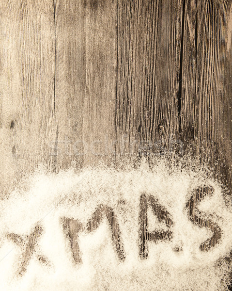 Christmas card with the inscription xmas  in the snow on a wooden background Stock photo © mcherevan