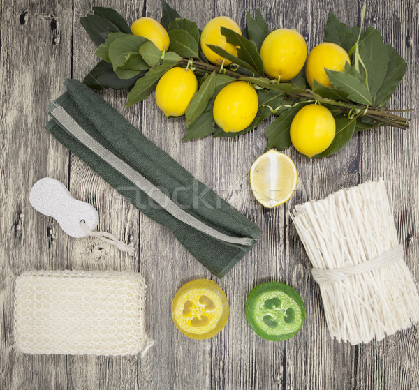 Stock photo: Set for spa handmade soap sponge lemon towel mirror perfume grass on wooden background