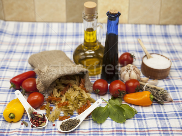 Fusilli Italian pasta set for the creation : cherry tomatoes, olive oil, balsamic sauce, garlic, spi Stock photo © mcherevan