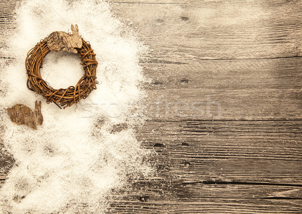 Stock photo: Glittering gold Christmas balls, bells,wreath, and star on wooden background with snow .