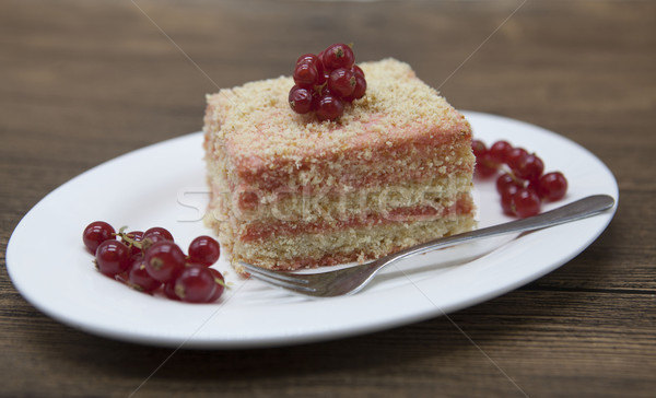 Fresh delicious diet cake with berry red currant at Dukan Diet on a porcelain plate with a spoon on  Stock photo © mcherevan