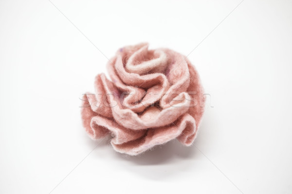 Beautiful pink rose flower milled wool on a white background. Stock photo © mcherevan