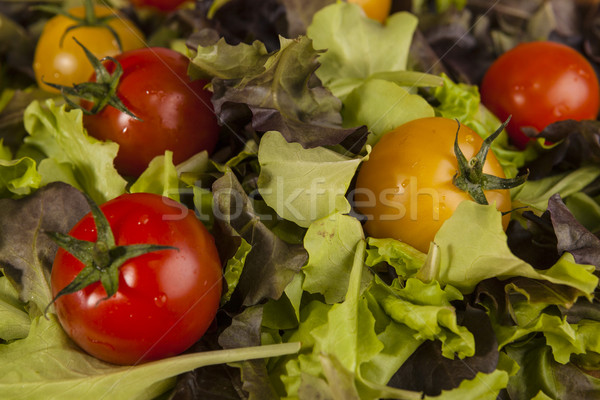 Fresh lettuce and red and yellow cherry tomatoes.  Stock photo © mcherevan