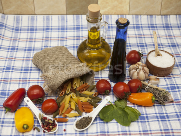 Penne rigate Sicilian pasta set for the creation : cherry tomatoes, olive oil, balsamic sauce, garli Stock photo © mcherevan