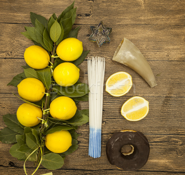  Branch lemons  donuts candles  crown of thorns and goat horn. Symbols of the great holiday of Hanuk Stock photo © mcherevan