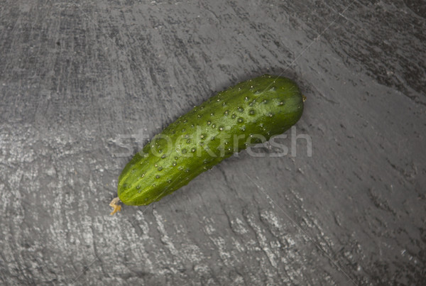 Fresh appetizing tasty cucumber on a stone background. Stock photo © mcherevan
