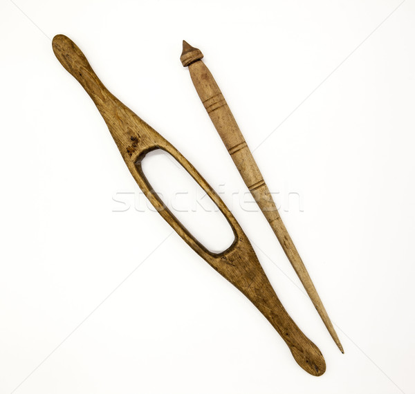 Stock photo: Two old wooden spindle for the manufacture of woolen threads on a white background