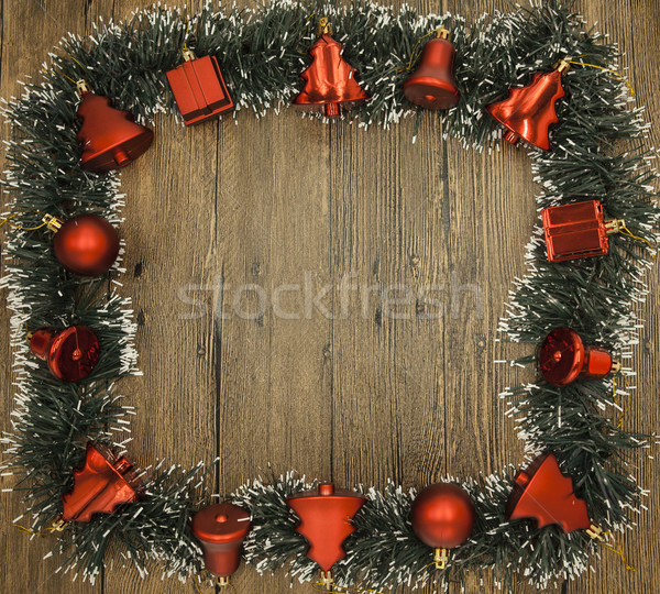 Christmas card with a fringe of branches of Christmas trees and festive toys on branches Stock photo © mcherevan