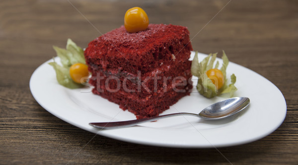 Red Velvet, fresh delicious diet cake with berry Physalis at Dukan Diet on a porcelain plate with a  Stock photo © mcherevan