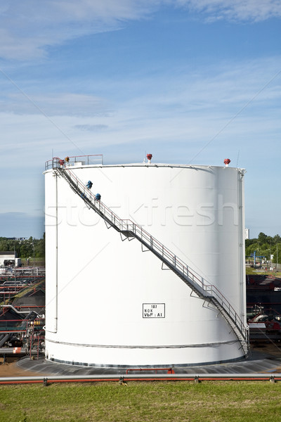 white tanks in tank farm with blue sky  Stock photo © meinzahn