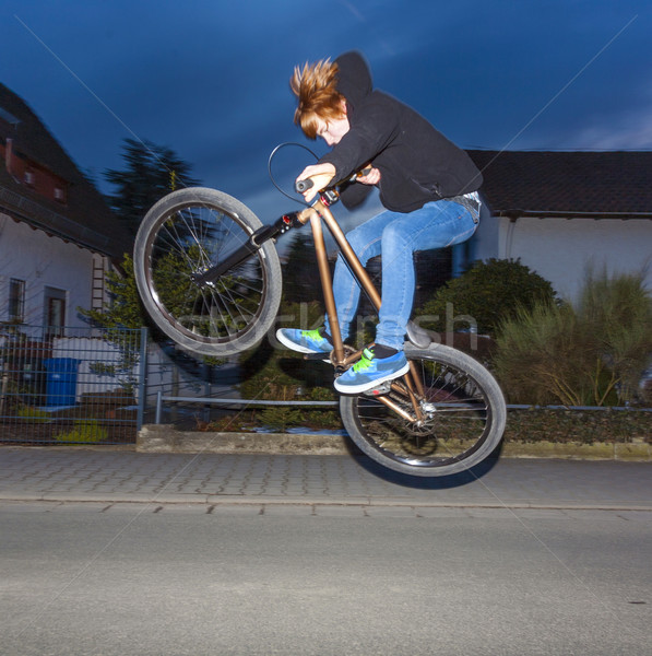 boy with dirtbike is going airborne  Stock photo © meinzahn