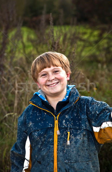 Stock photo: boy after a quad trip with dirt on face  