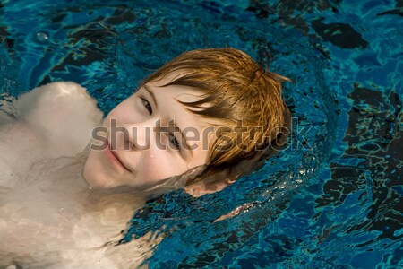 boy swimming in a natural basin of water Stock photo © meinzahn