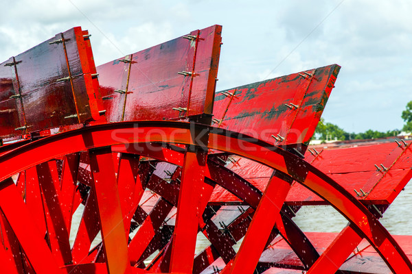 Red Riverboat Paddle Wheel in a River with Trees Stock photo © meinzahn