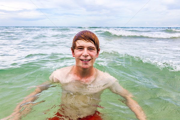 teenager with red hair enjoys  swimming Stock photo © meinzahn