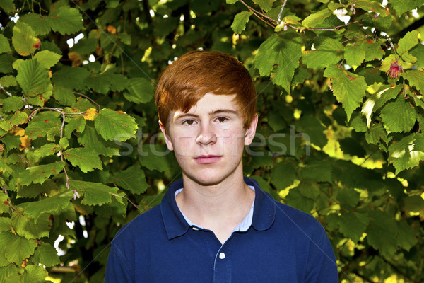 portrait of attractive happy smiling boy in the garden Stock photo © meinzahn