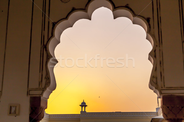 Sunset with view to a top of a small temple in Jaipur  Stock photo © meinzahn