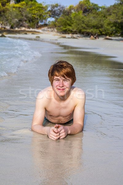  boy with red hair is enjoying the beautiful beach Stock photo © meinzahn