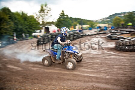 young boy is faszinated by quad driving and enjoyes is, his face Stock photo © meinzahn