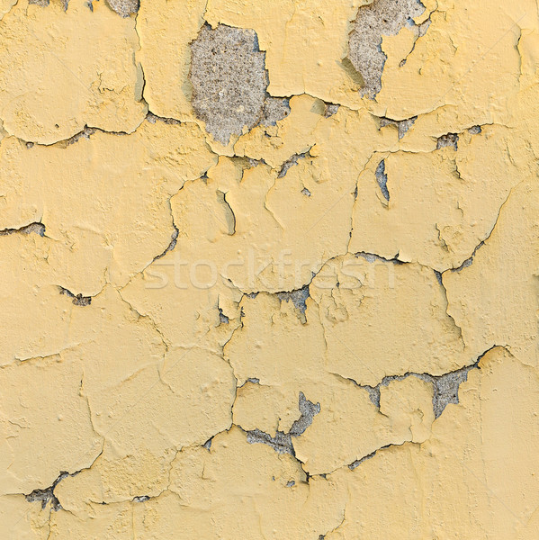 Stock photo: peeling yellow and white paint on a rough surface