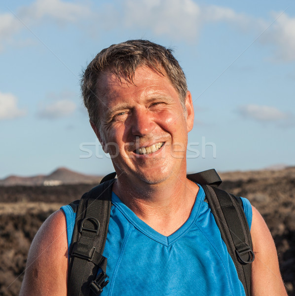 man on walking trail in volcanic area Stock photo © meinzahn