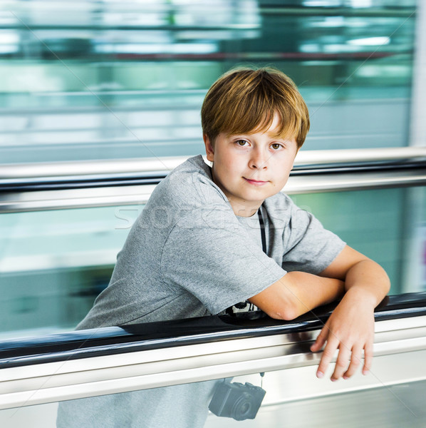 boy on moving staircase Stock photo © meinzahn