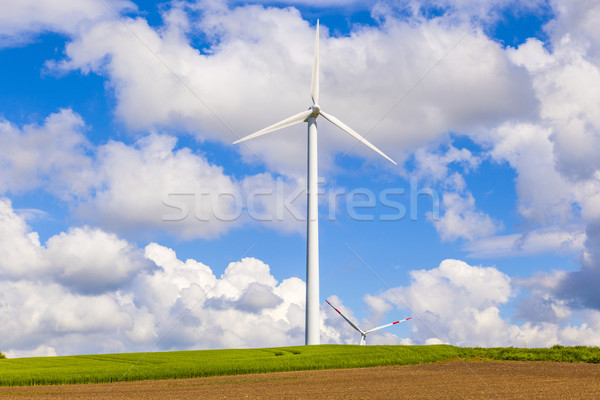 wind turbine generating electricity on blue sky  Stock photo © meinzahn