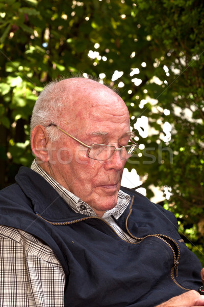 elderly man sitting in the garden Stock photo © meinzahn