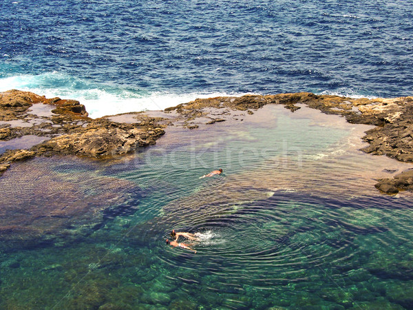 people diving in a natural basin in the rocks coastline of Lanza Stock photo © meinzahn